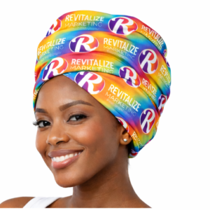 Premium sublimated headwrap (doek) with full-colour Revitalize Marketing logo pattern on polyester fabric