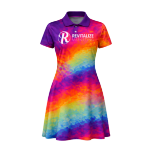 Sublimated golf dress with vibrant rainbow design by Revitalize Marketing